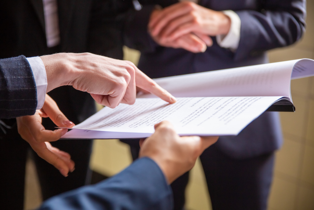 Technician reviewing a document on Decree 18/2023 concerning water disinfection<br>